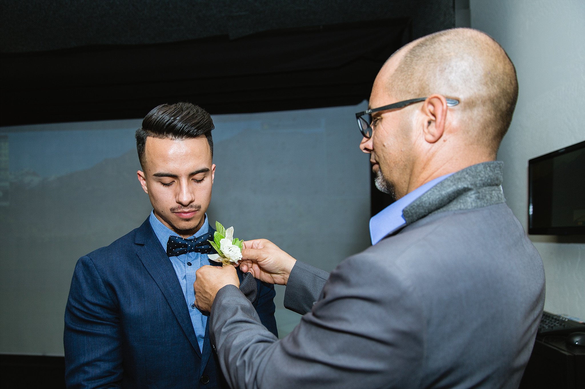 Grooms Father helping him get ready at Legacy Golf Resort in Phoenix, Arizona by PMA Photography