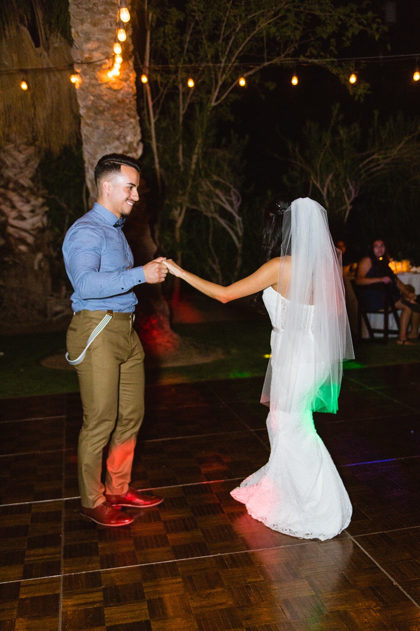 Bride and groom relax on the dance floor at Legacy Golf Resort in Phoenix, Arizona by PMA Photography