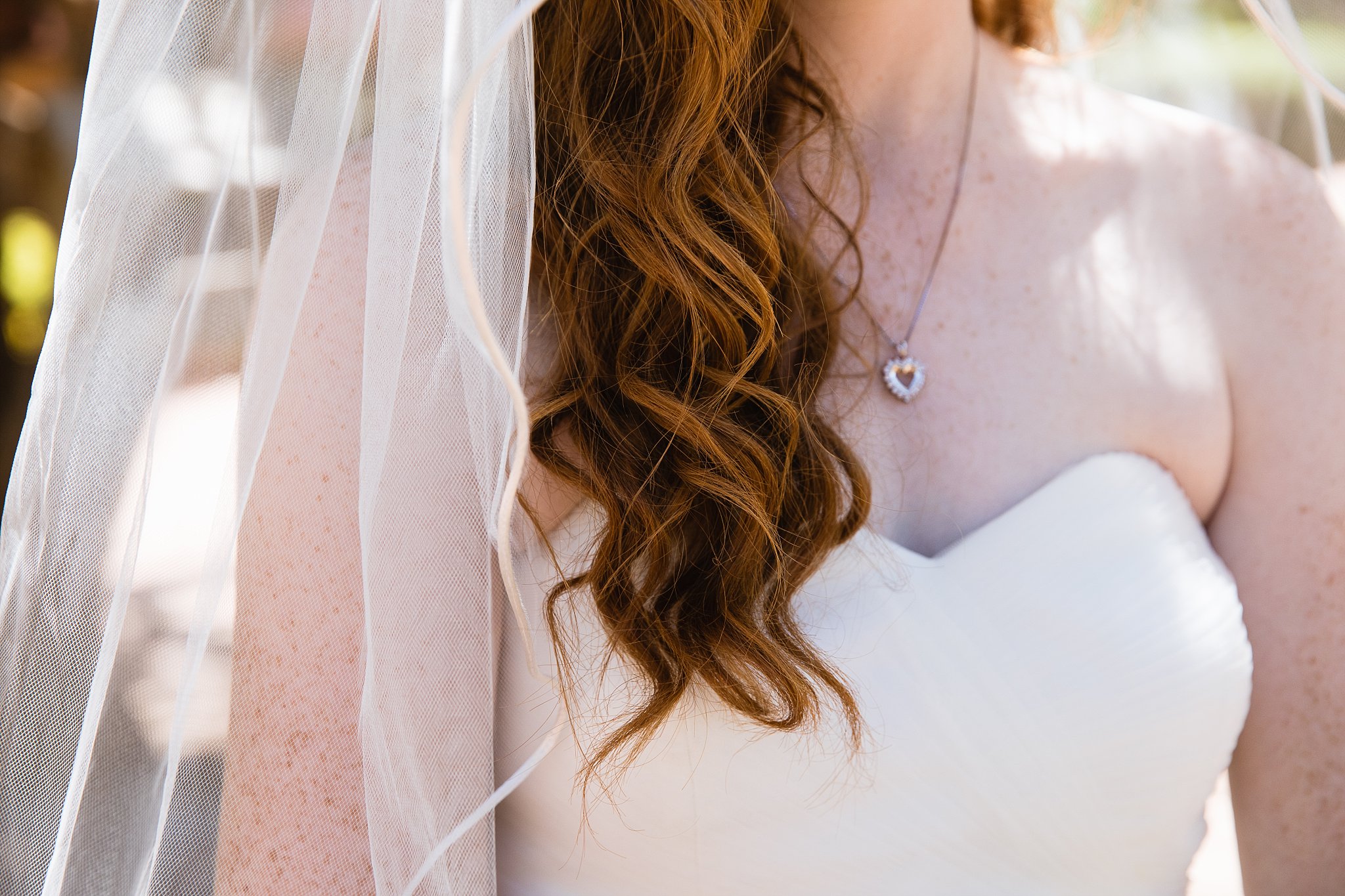 Bride's red wavy hair on her wedding day by PMA Photography.