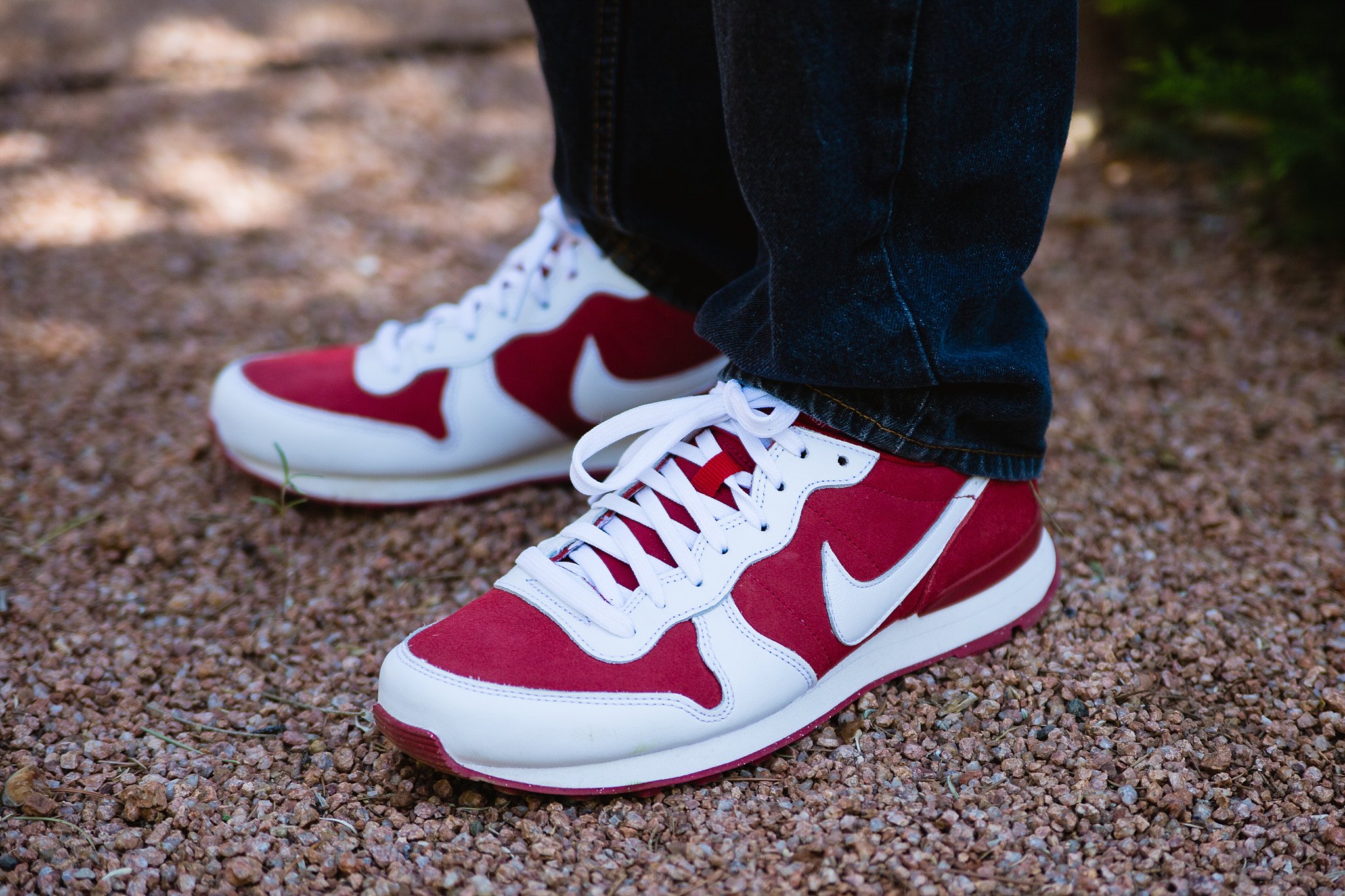 Groom's casual red Nike shoes for his wedding day by Arizona wedding photographers PMA Photography.