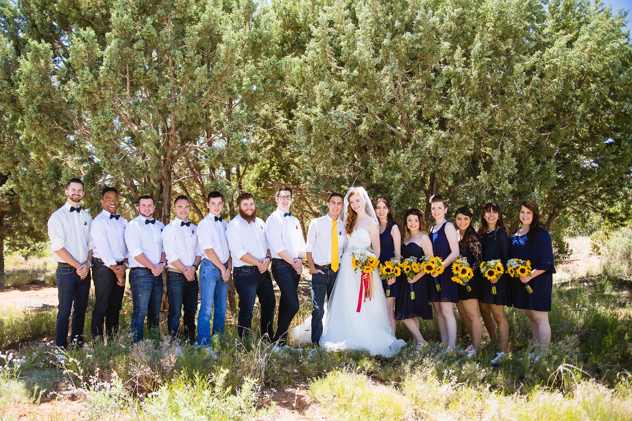 Bridal party together at a Sky Ranch Lodge wedding by Arizona wedding photographer PMA Photography.