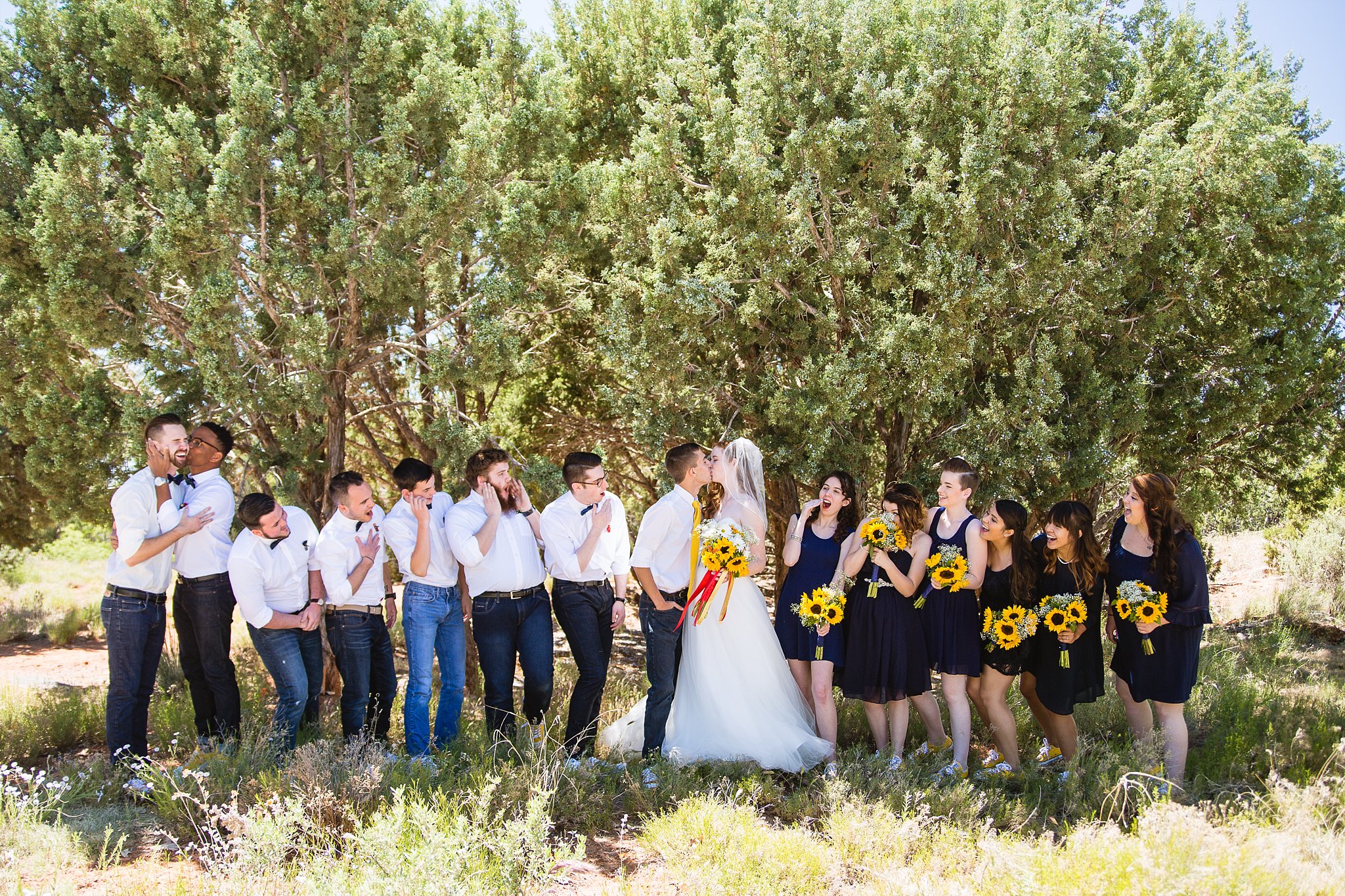 Bridal party having fun together at Sky Ranch Lodge weding by Arizona wedding photographer PMA Photography.