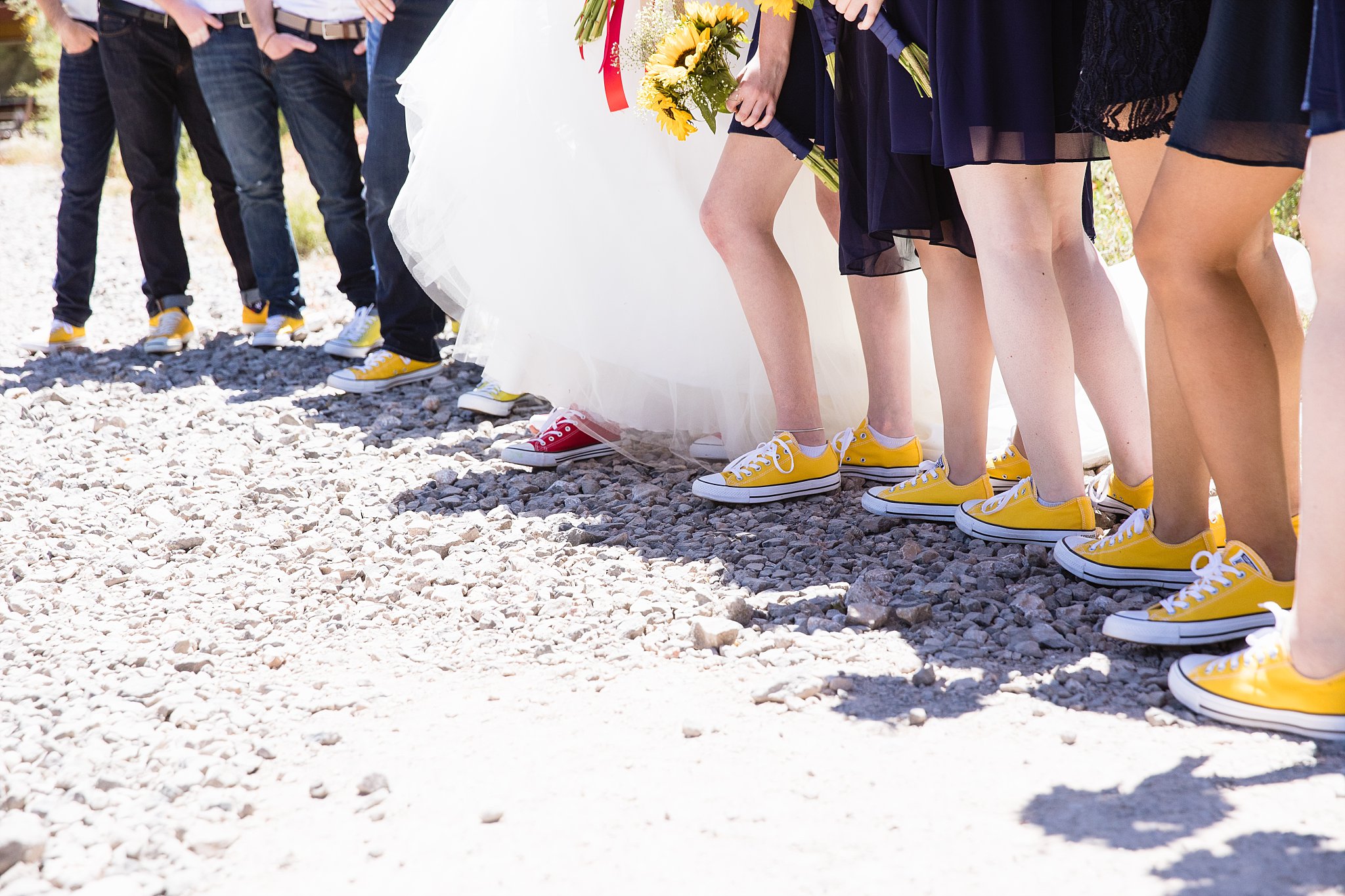 Wedding party's yellow and red converse by PMA Photography.