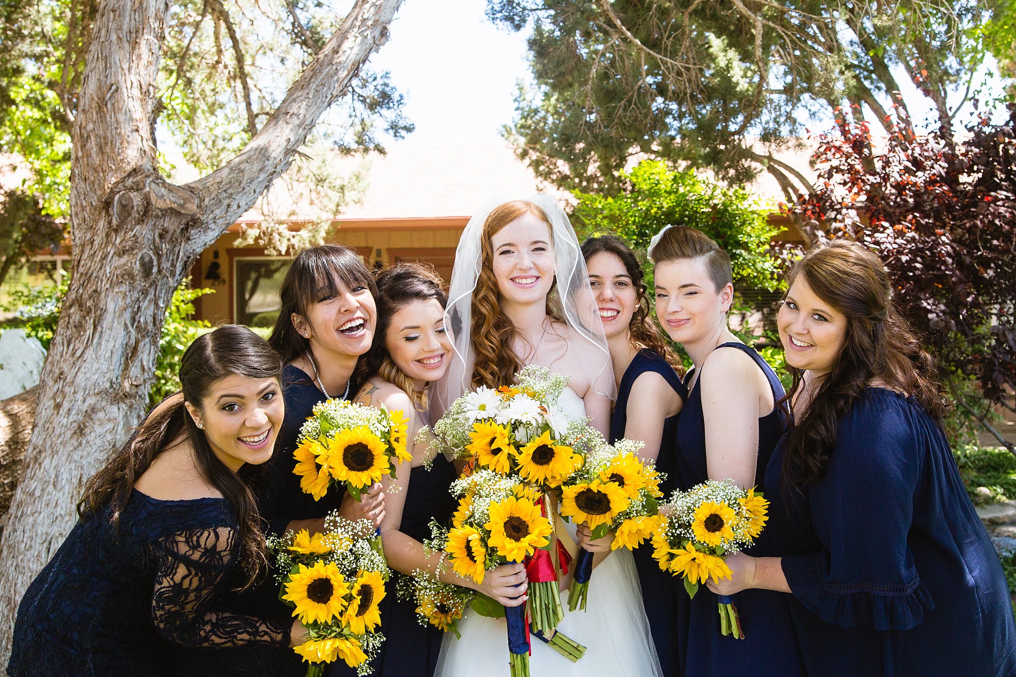 Bride and bridesmaids together at a Sky Ranch Lodge wedding by Arizona wedding photographer PMA Photography.