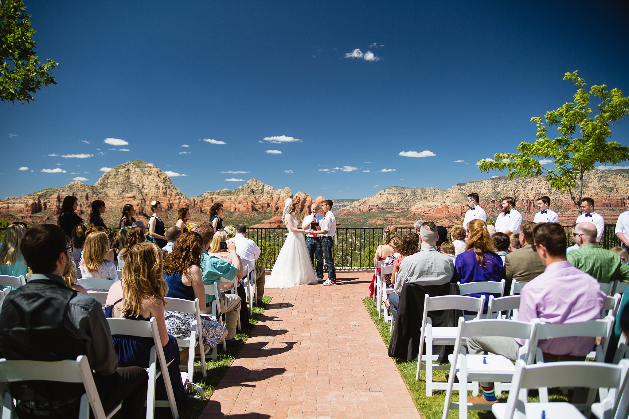 Wedding ceremony at Sky Ranch Lodge by Arizona wedding photographer PMA Photography.
