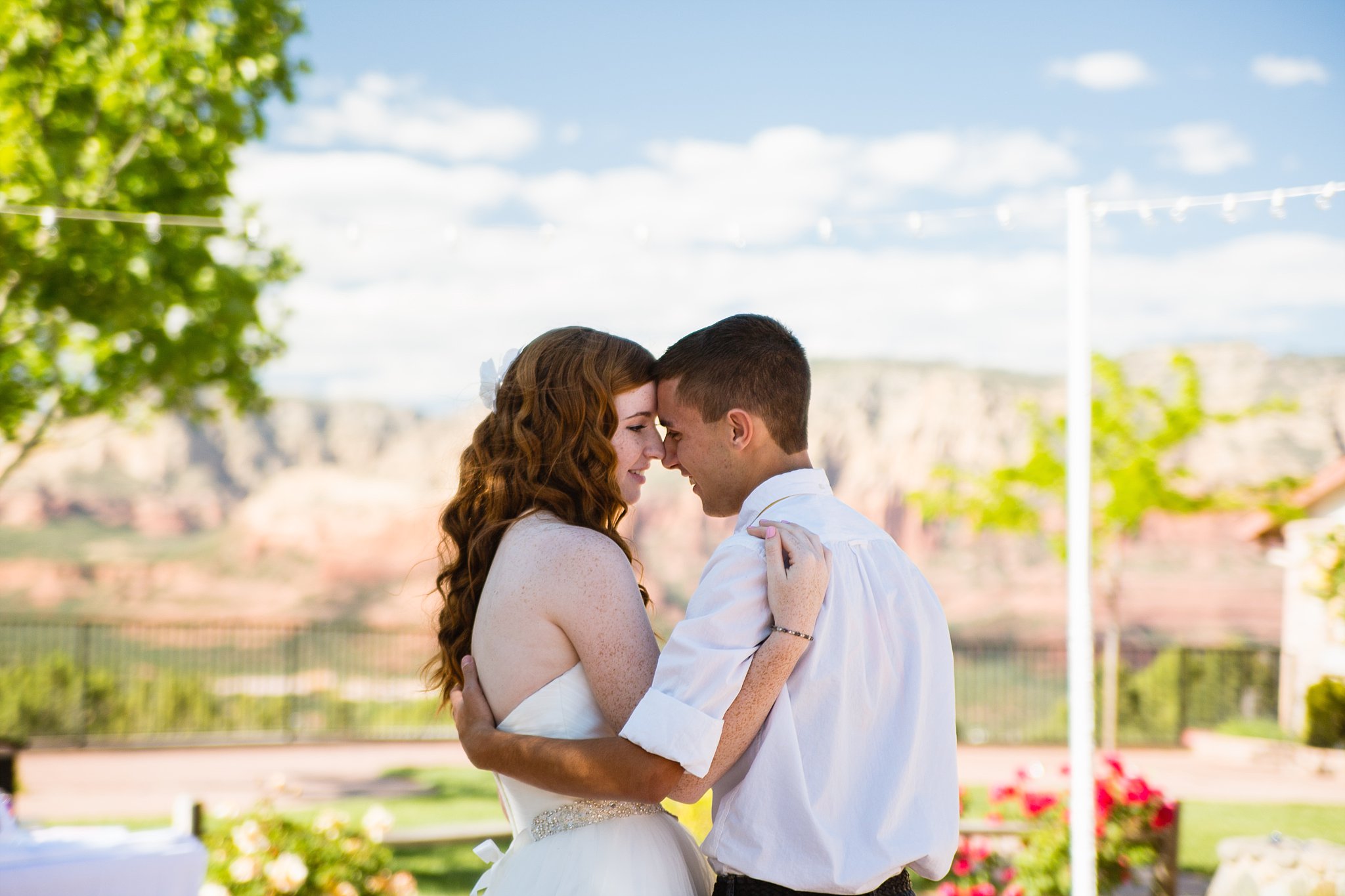 Bride and groom sharing first dance at their Sky Ranch Lodge wedding reception by Arizona wedding photographer PMA Photography.