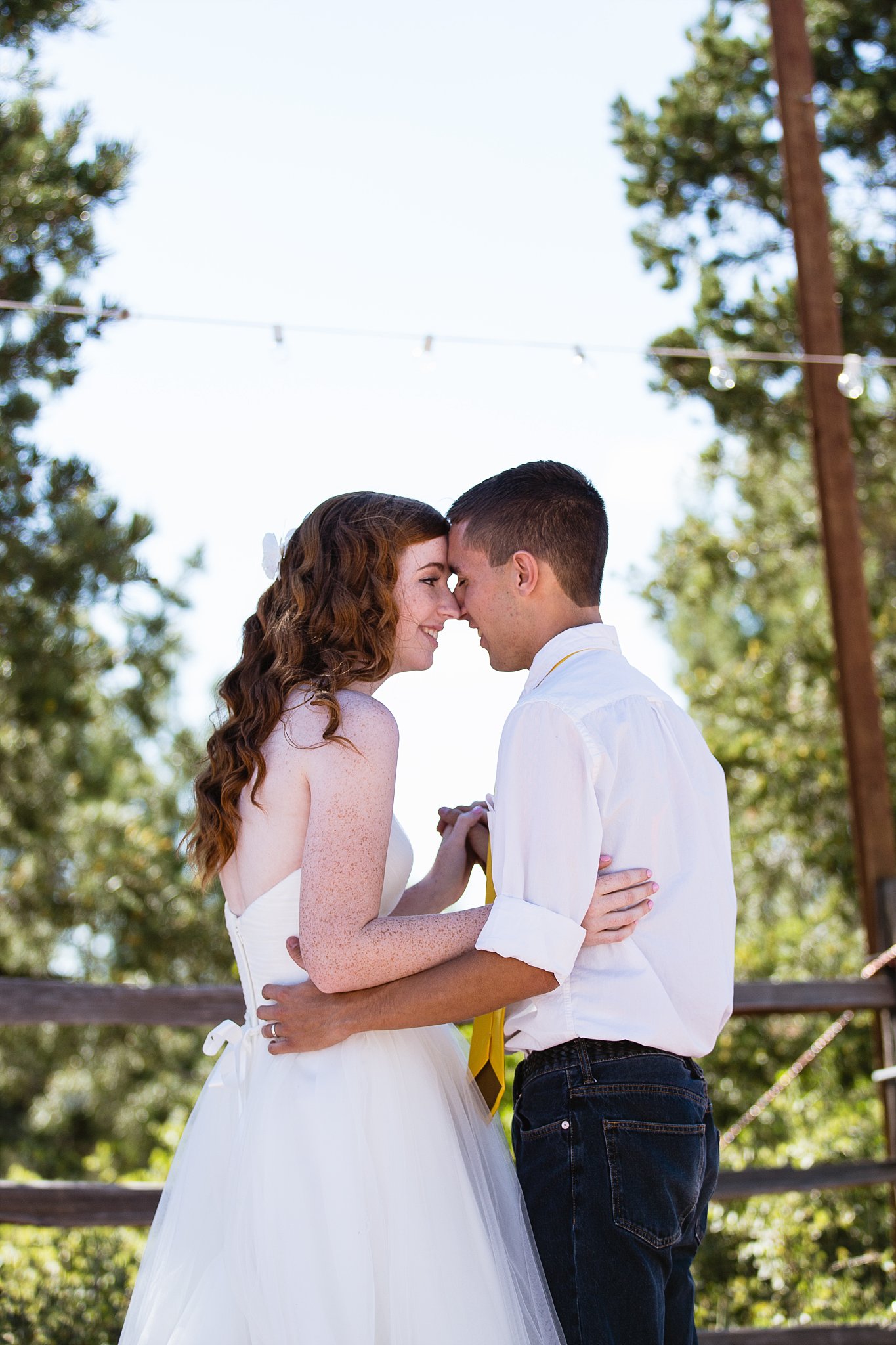 Bride and groom sharing first dance at their Sky Ranch Lodge wedding reception by Arizona wedding photographer PMA Photography.
