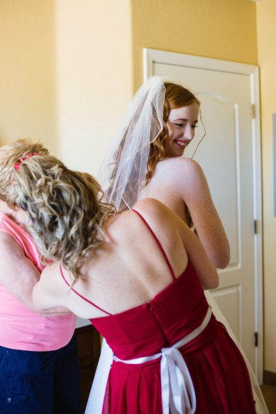Bride getting ready on her wedding day by PMA Photography.
