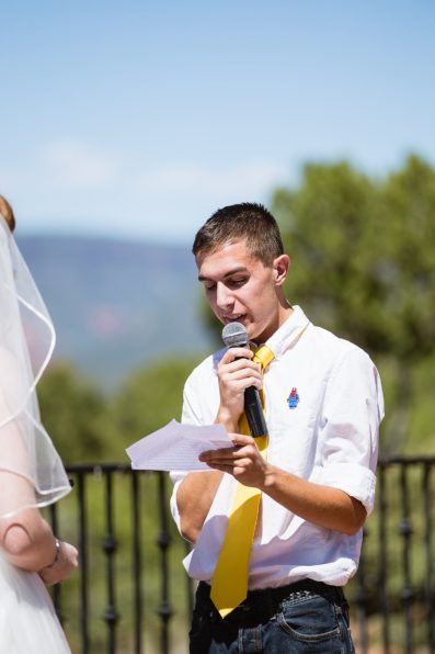 Groom reading his vows during their Sedona wedding ceremony by PMA Photography.