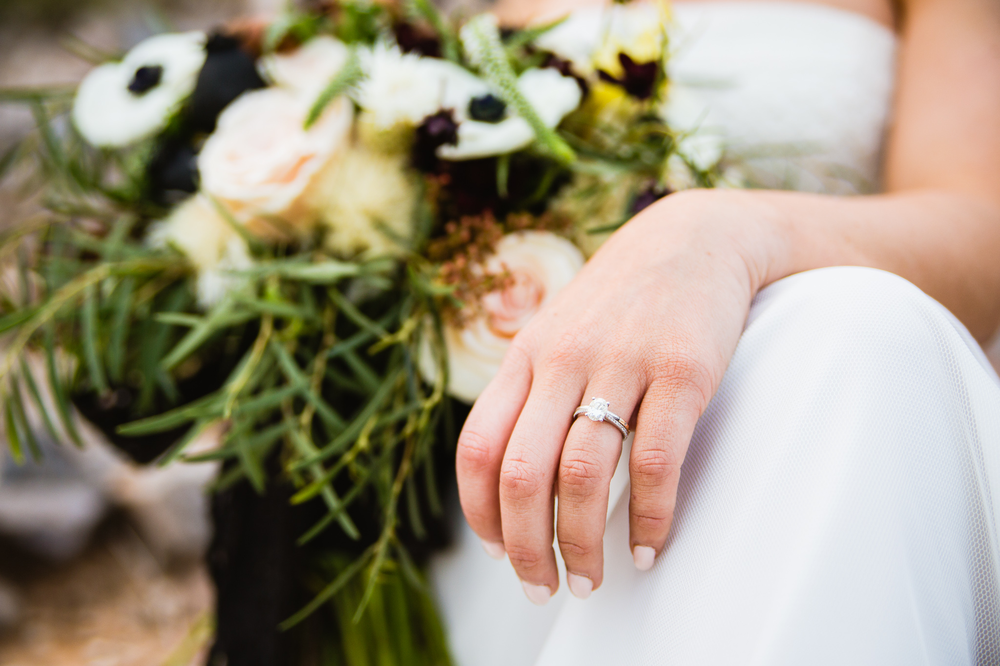 Freshly cleaned wedding ring on a woman's hand on her wedding day by PMA Photography.