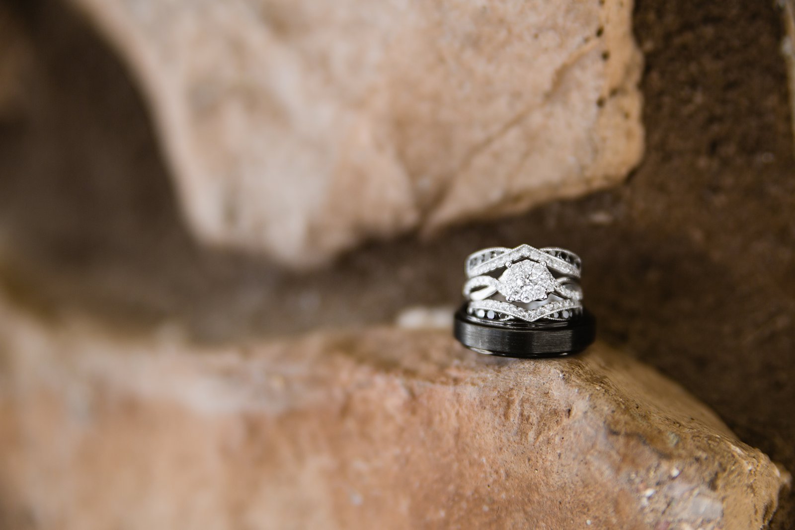 Alternative black and diamond wedding ring detail image by PMA Photography.