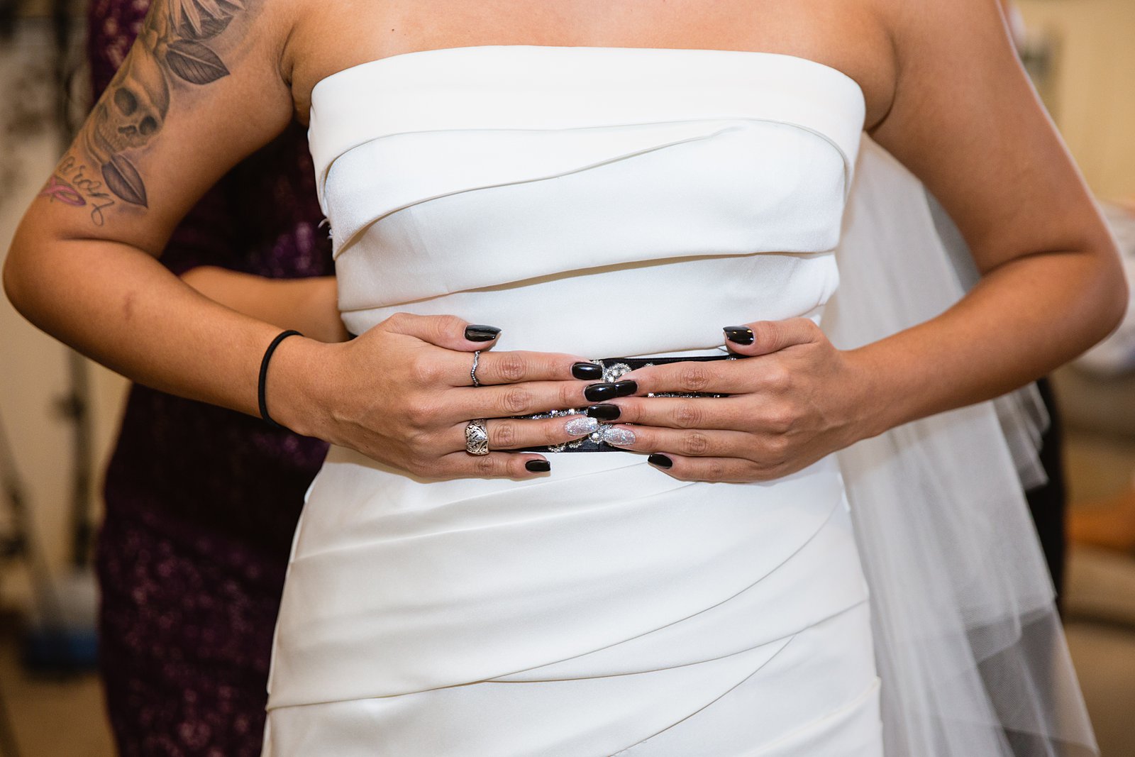 Detail of bride's black and silver nail polish while getting ready for her wedding day by Mesa photographers PMA Photography.