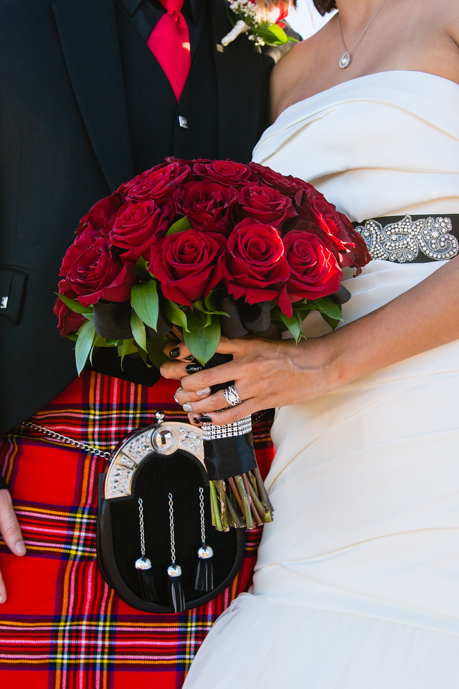Red rose bouquet with red Scottish kilt by Mesa wedding photographer PMA Photography.