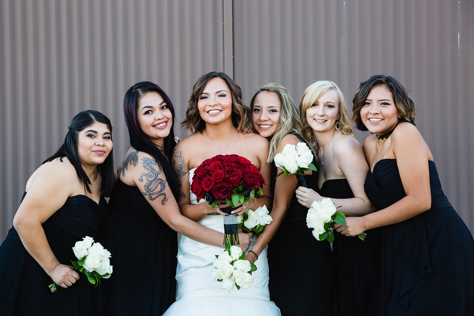 Classic black and red bridesmaids by Arizona wedding photographer PMA Photography.