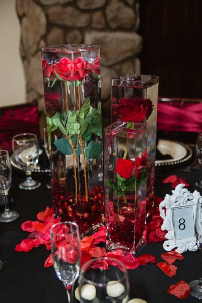 Classic black and red reception details at the Superstition Manor by PMA Photography.