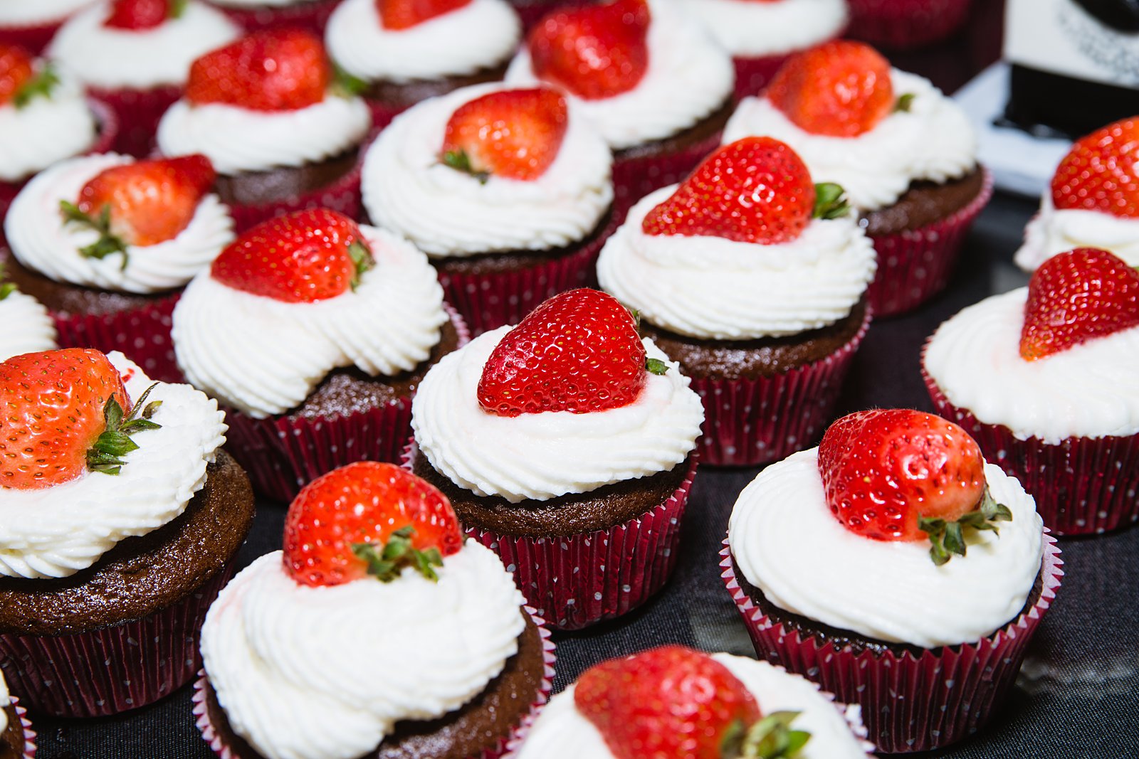 Chocolate wedding cupcakes with fresh strawberries by PMA Photography.