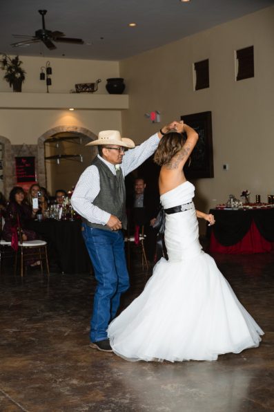 Bride dances with her father at the Superstition Manor by Arizona wedding photographers PMA Photography.