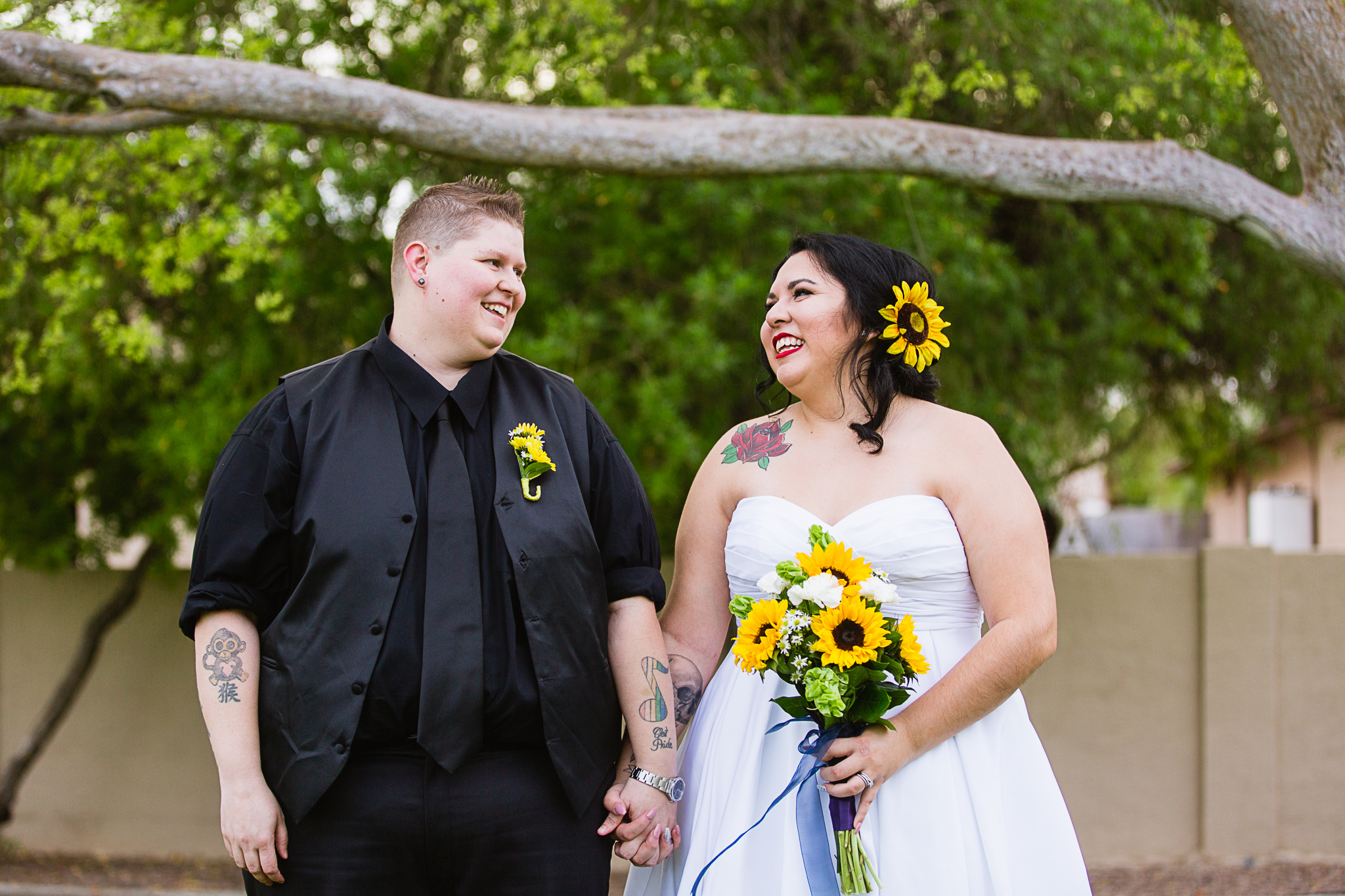 Brides a laugh on their wedding day by LGBT friendly wedding photographer PMA Photography.