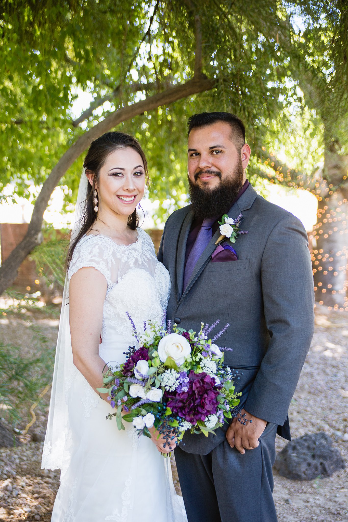 Bride and groom from their purple and grey rustic wedding at Schnepf Farm's Farmhouse by Phoenix wedding photographers PMA Photography.