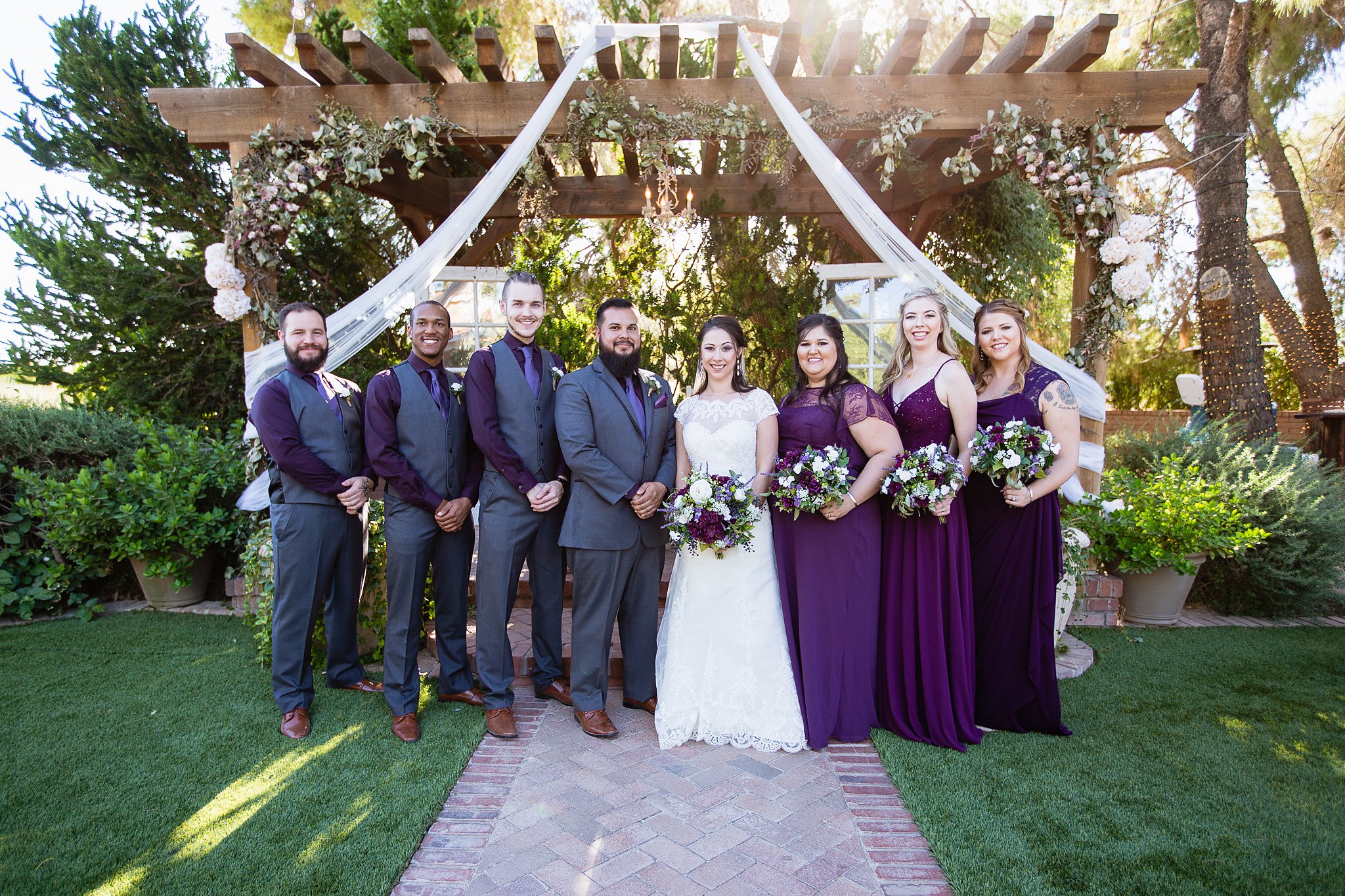 Purple and grey bridal party at the Schnepf Farms Farmhouse by Arizona wedding photographer PMA Photography.