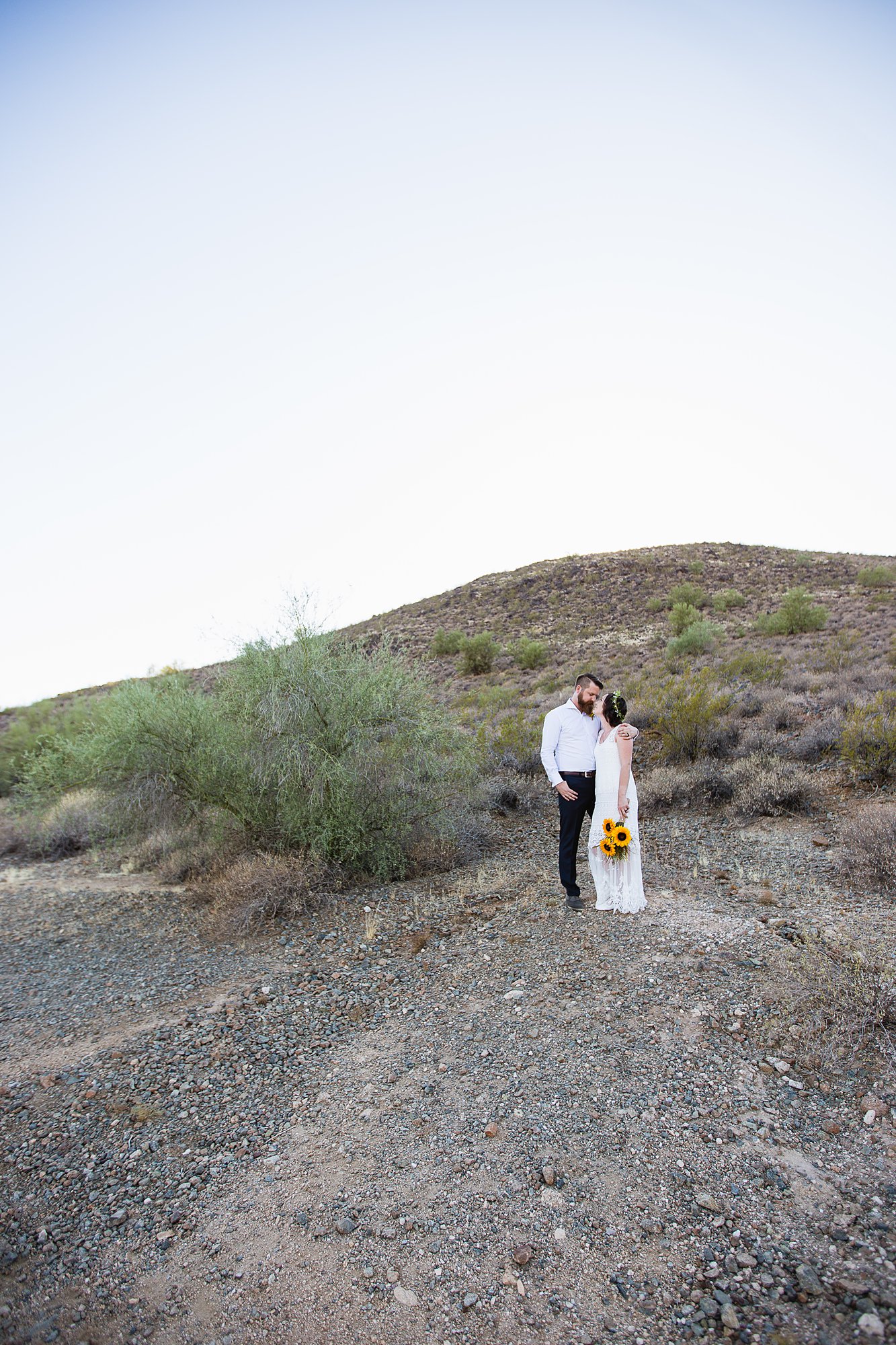 Simple boho bride and groom in the Arizona desert by Phoenix wedding photographers PMA Photography.