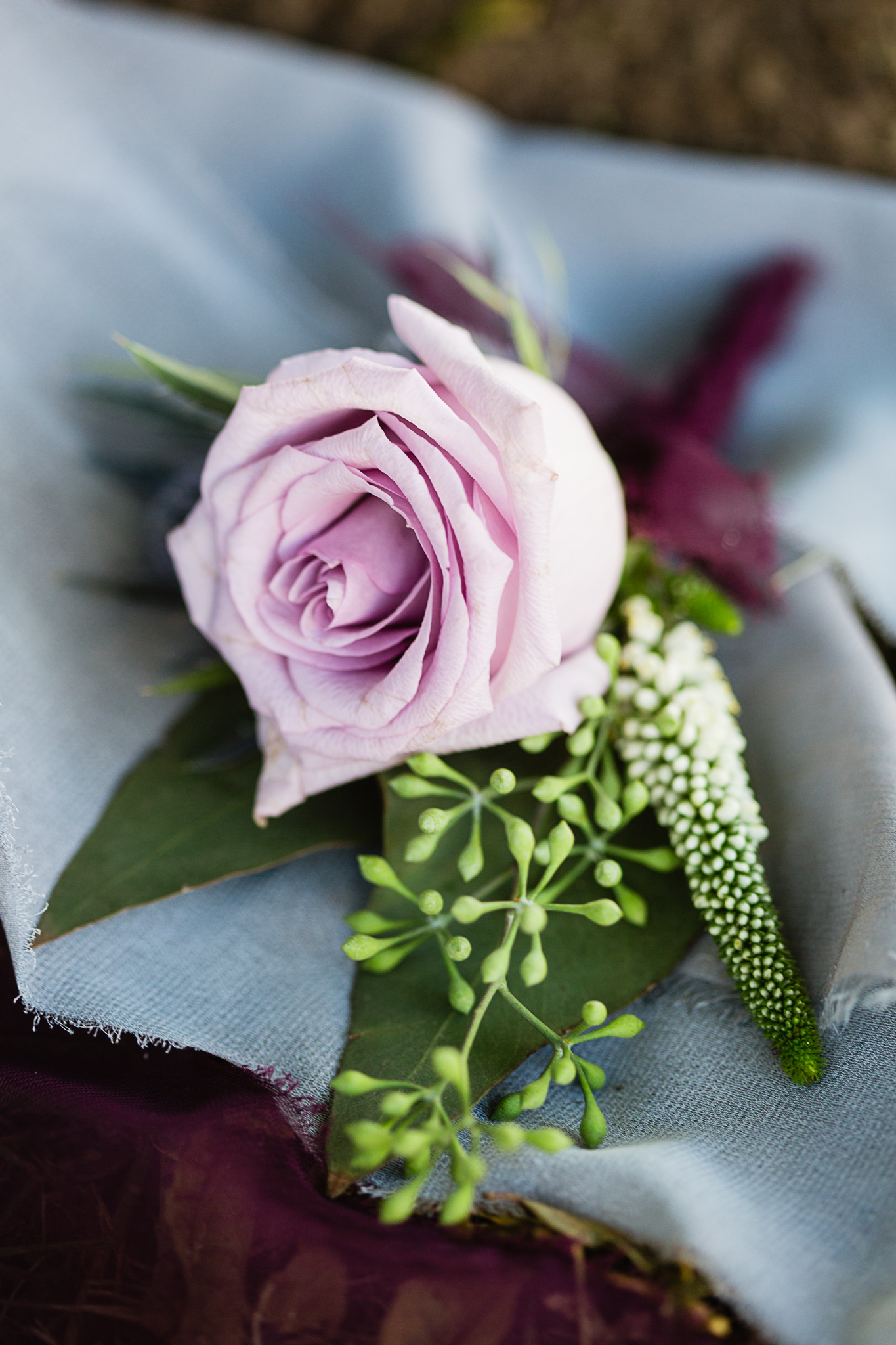 Lavender rose groom wedding boutonniere by PMA Photography.