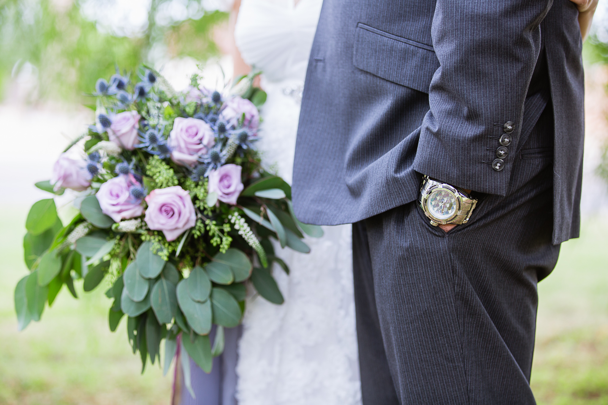 Groom's lavender and dusty blue watch to match the bridal bouquet by Phoenix wedding photographer PMA Photography.