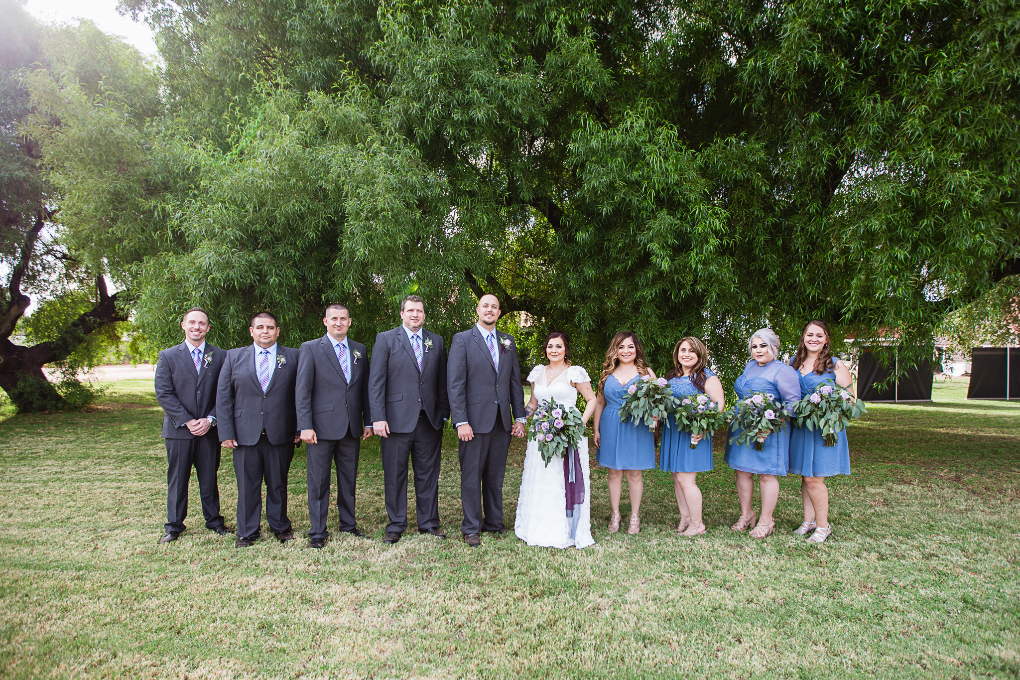 Dusty blue and lavender bridal party by Arizona wedding photographer PMA Photography.