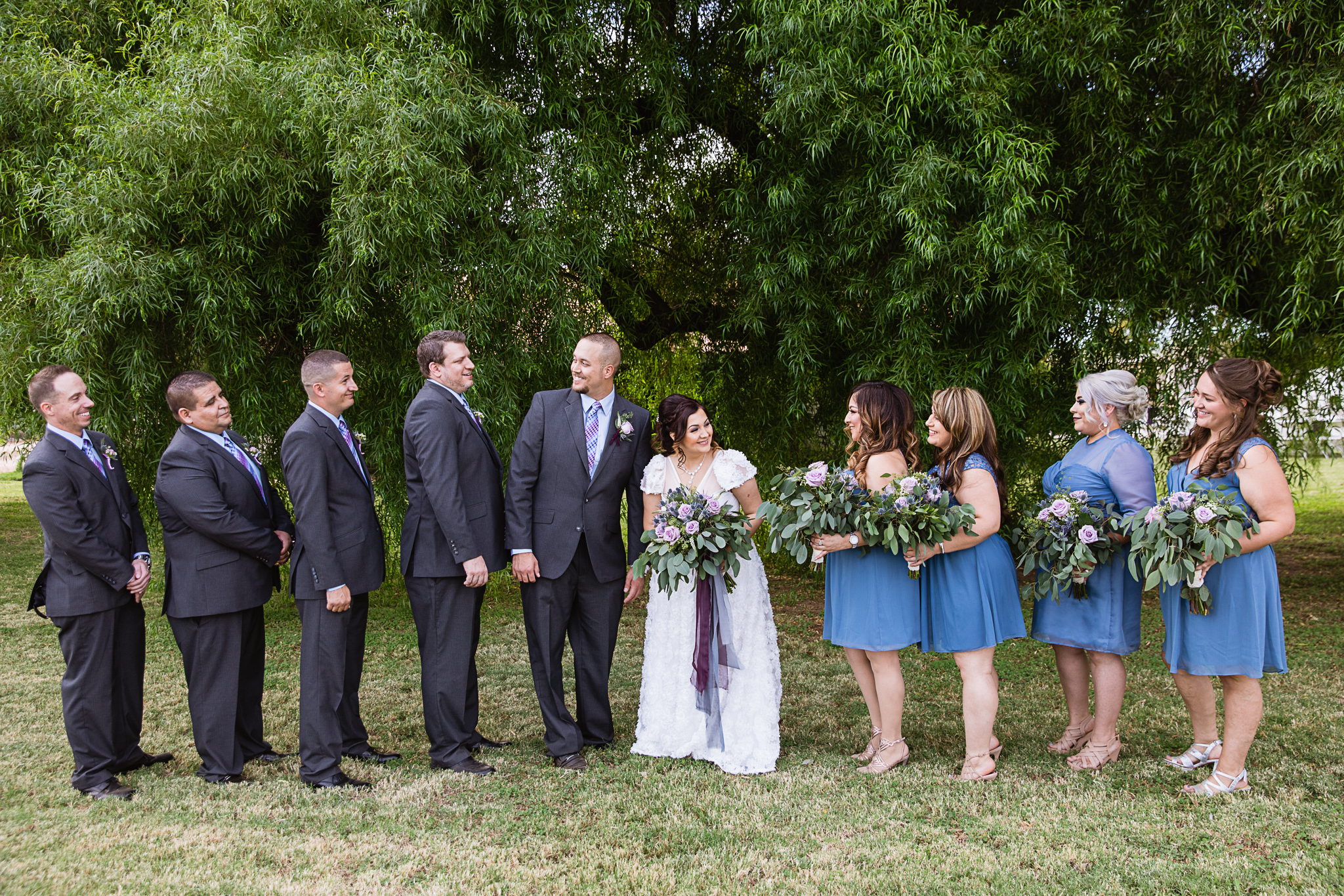Dusty blue and lavender bridal party by Arizona wedding photographer PMA Photography.