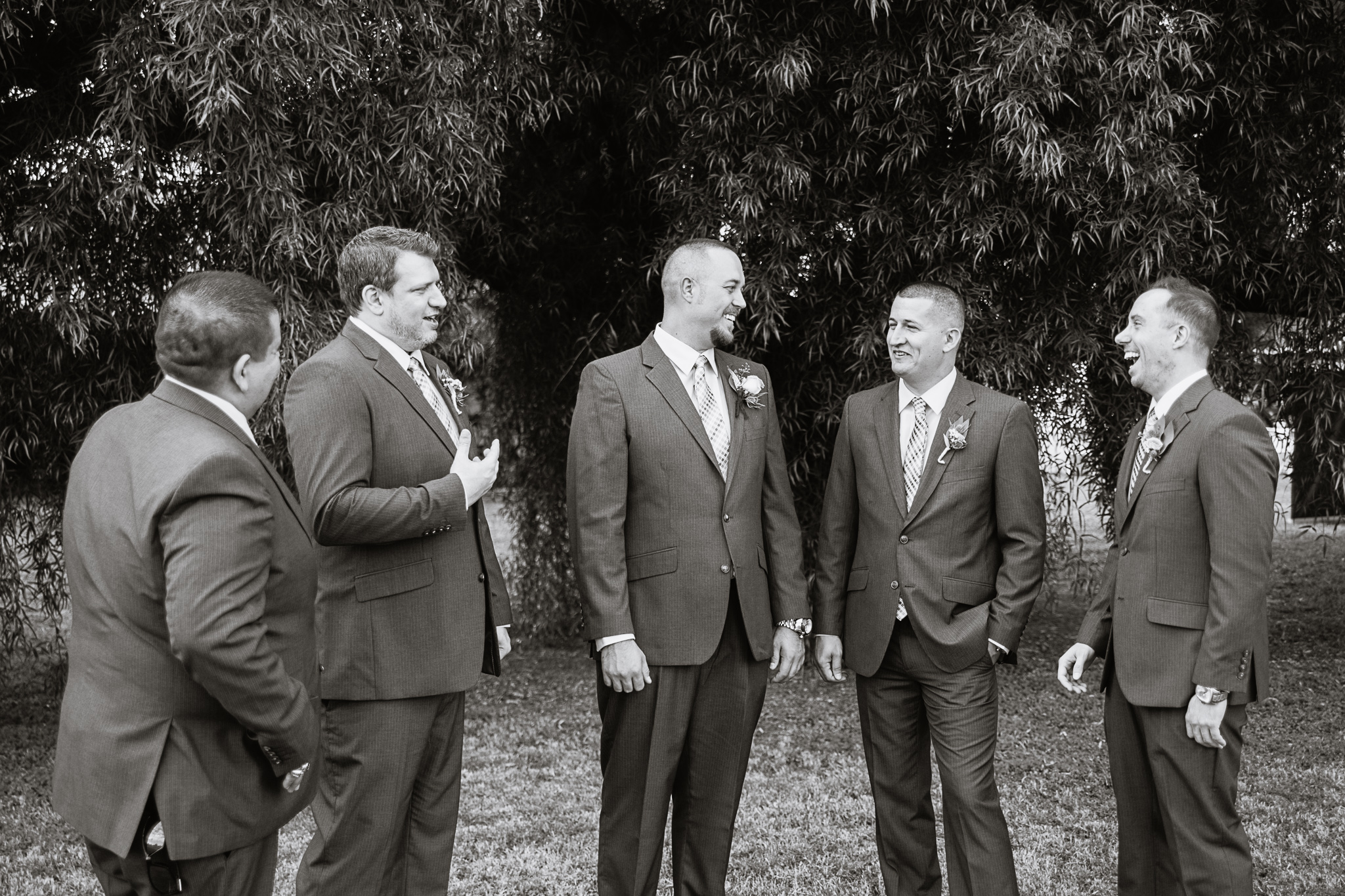 Black and white image of groom and groomsmen by Phoenix wedding photographer PMA Photography.