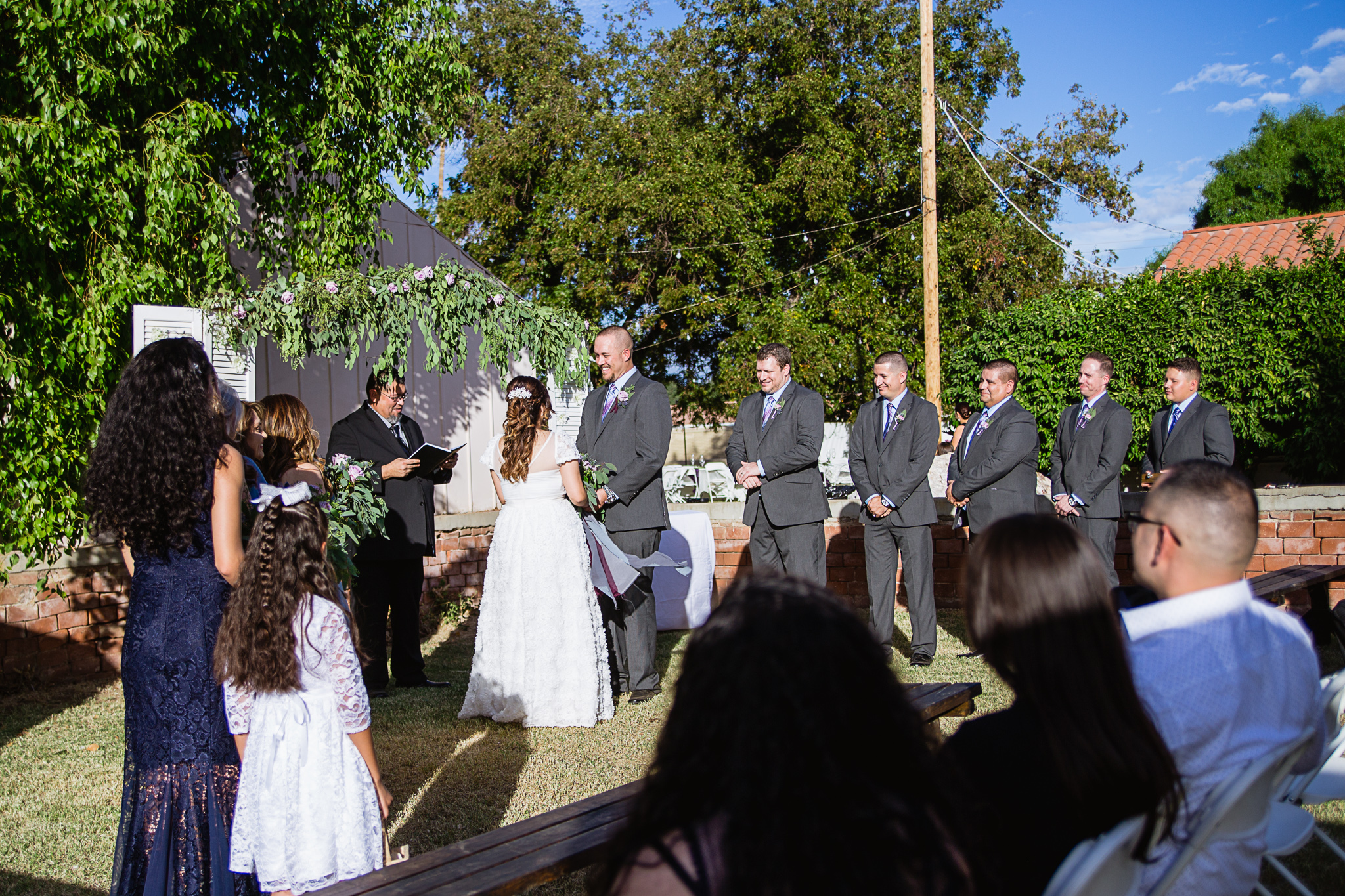 Backyard wedding ceremony by PMA Photography.