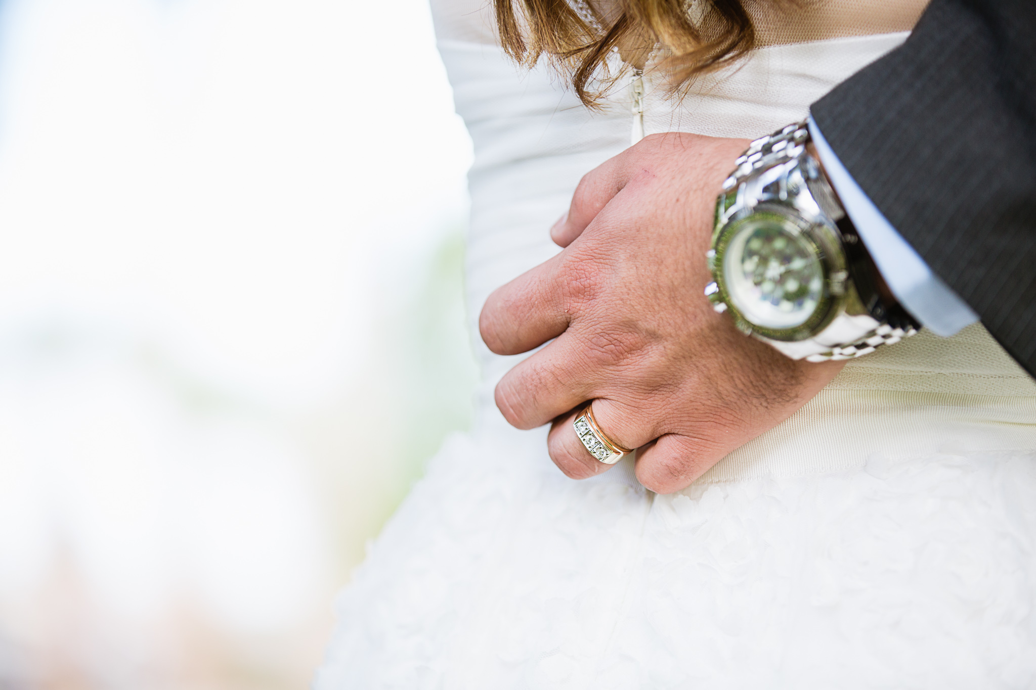 Groom wearing his grandfather's wedding ring by Arizona wedding photographer PMA Photography.