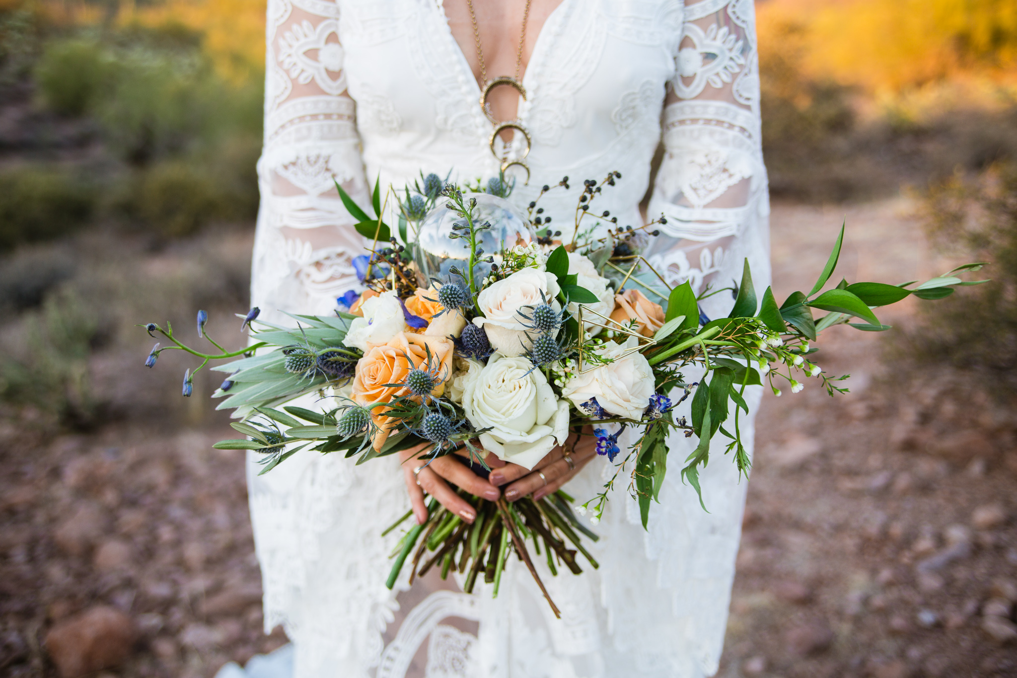 Boho witchy white blue sage and golden bouquet with gold triangles and a crystal ball by Moelleux Events at the Superstition Mountains.