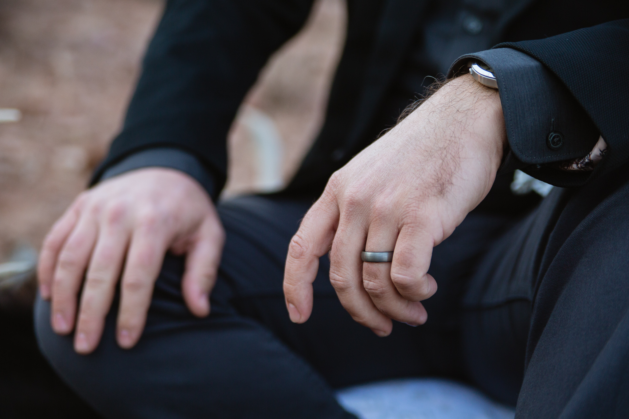 Wedding detail photograph of grooms grey wedding ring.