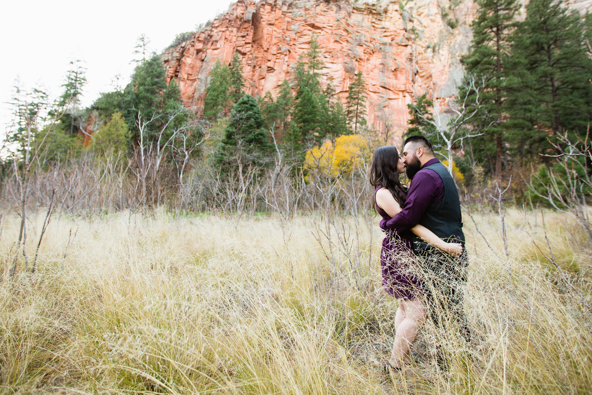 Couple Kissing at West Fork Oak Creek Trail in Sedona Arizona Outdoor Engagement Session Locations