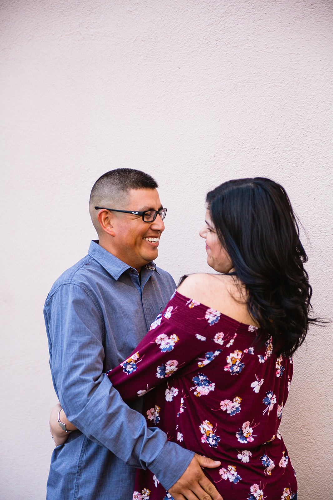 Couple sharing one reason they love each other during their engagement session by wedding photographer PMA Photography.