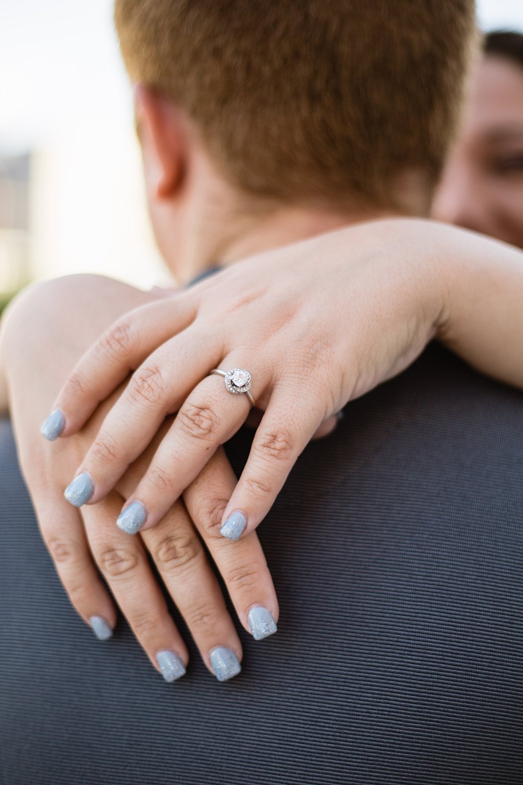 Close up image of bride's engagement ring during her engagement session by PMA Photography.