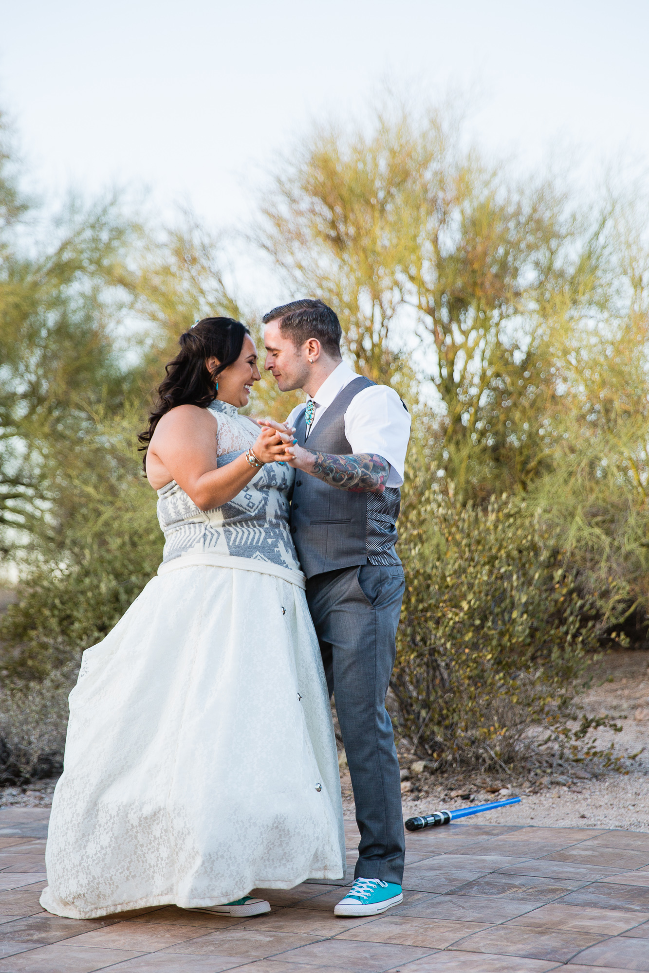 Bride and grooms first dance at their Lost Dutchman State Park wedding reception by Arizona wedding photographer PMA Photography.