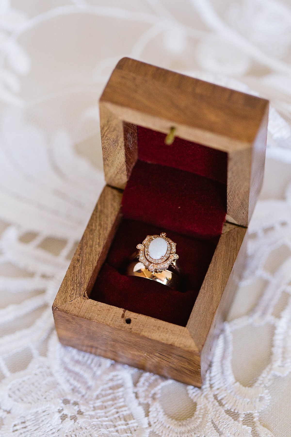 Rose gold and opal unique, alternative wedding ring in a wooden box by PMA Photography.