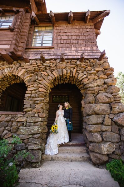 Bride and groom pose together in the woods at the Riordan Mansion at their Scottish and Sunflower inspired wedding by Flagstaff wedding photographers PMA Photography.