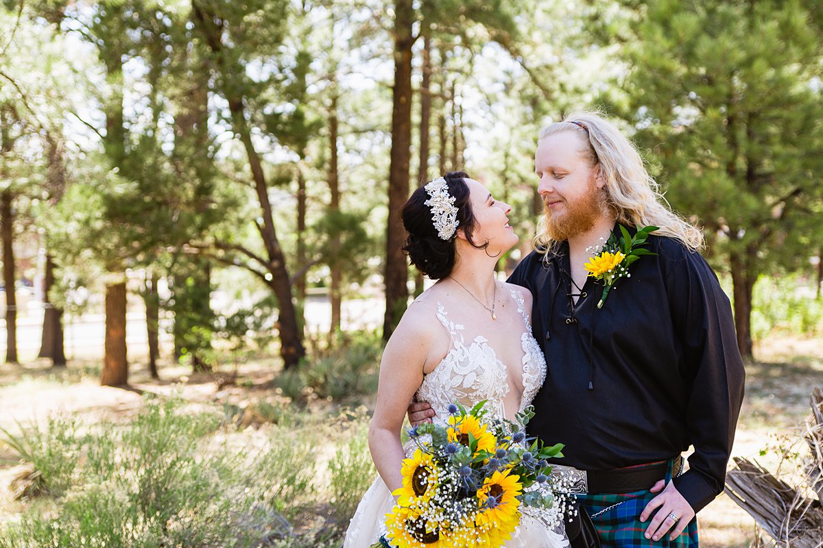 Bride and groom share an intimate moment at the Riordan Mansion at their Scottish and Sunflower inspired wedding by Flagstaff wedding photographers PMA Photography.