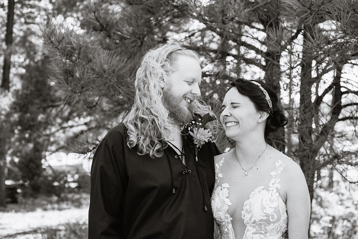 Bride and groom share a laugh the Riordan Mansion at their Scottish and Sunflower inspired wedding by Flagstaff wedding photographers PMA Photography.