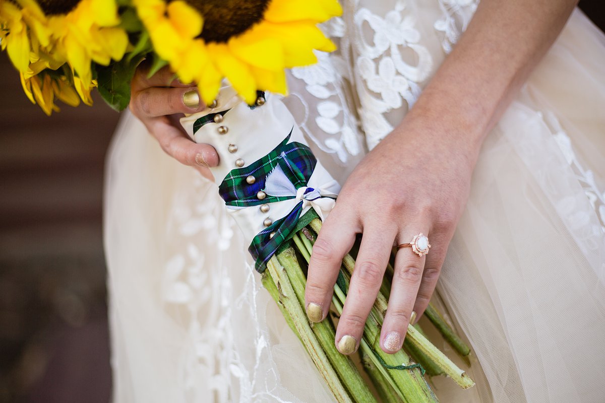 Bride's bouquet wrapped with her Scottish tartan by PMA Photography.