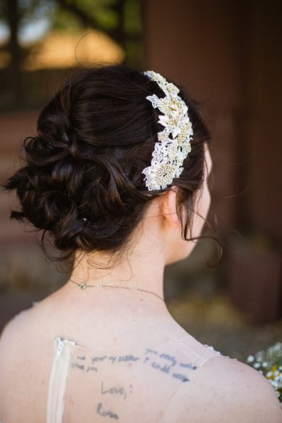 Bride's updo bridal hairstyle with beaded headpiece by PMA Photography.