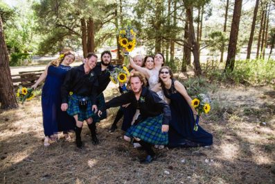 Wild navy and yellow bridal party in kilts at a Scottish and Sunflower inspired wedding at Riordan Mansion pose like they are in a photobooth by Flagstaff wedding photographer PMA Photography.