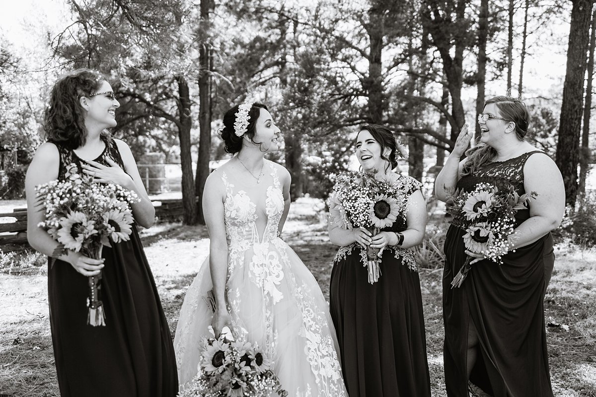 Black and white image of bridesmaids at a Scottish and Sunflower inspired wedding at Riordan Mansion by Flagstaff wedding photographer PMA Photography.