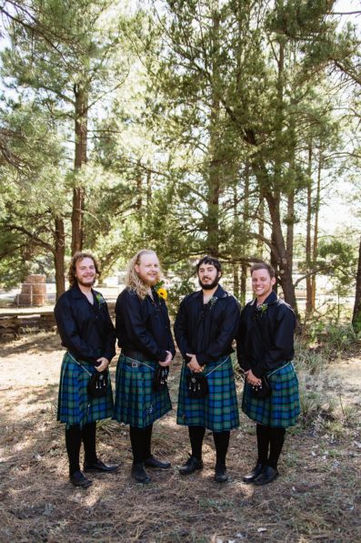 Navy and yellow groomsmen in kilts at a Scottish and Sunflower inspired wedding at Riordan Mansion by Flagstaff wedding photographer PMA Photography.