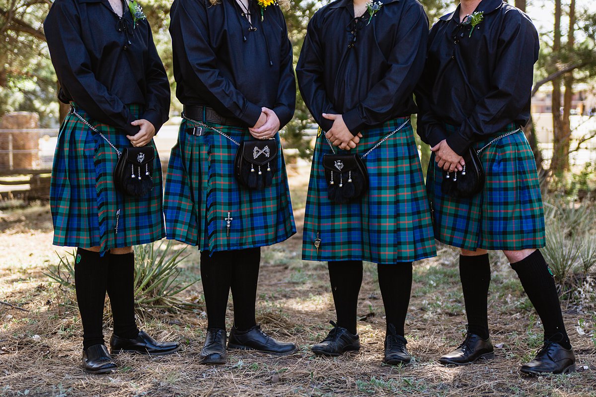 Navy and yellow groomsmen in kilts at a Scottish and Sunflower inspired wedding at Riordan Mansion by Flagstaff wedding photographer PMA Photography.