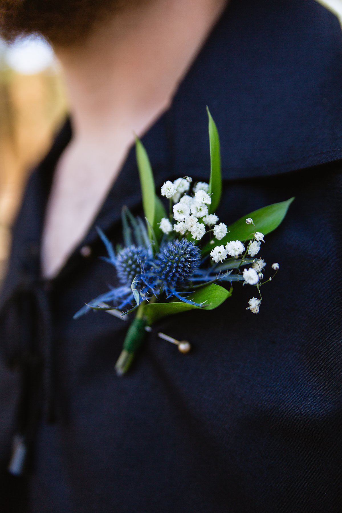 DIY Thistle and baby's breath groomsmen boutonniere by PMA Photography.