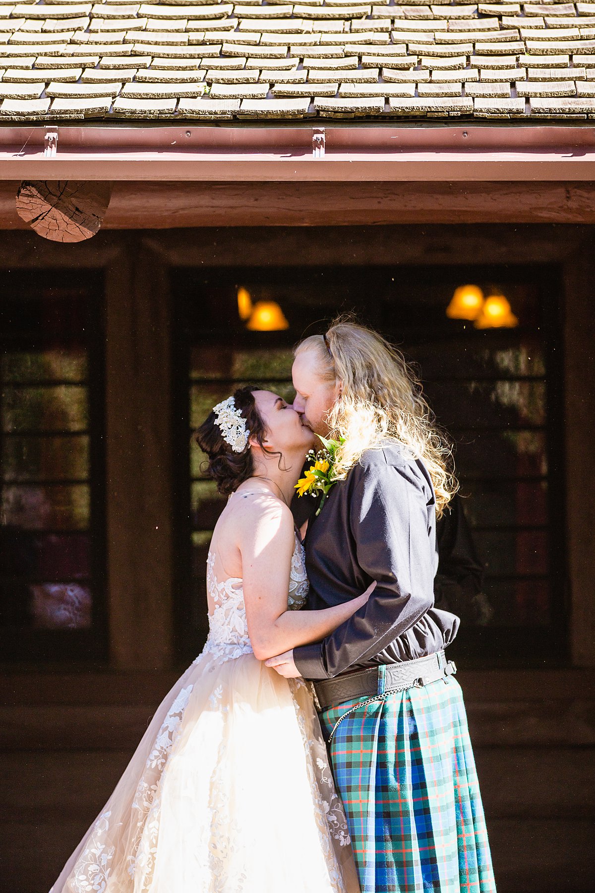 Bride and groom share their first kiss at Riordan Mansion by PMA Photography.